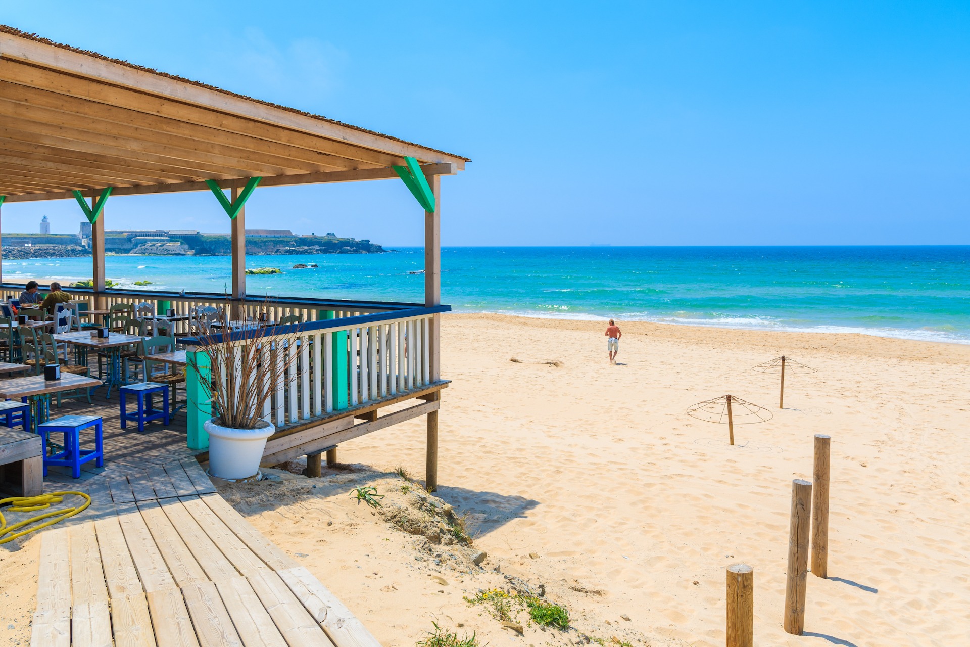 Restaurant terrace on sandy Tarifa beach, Costa de la Luz, Spain