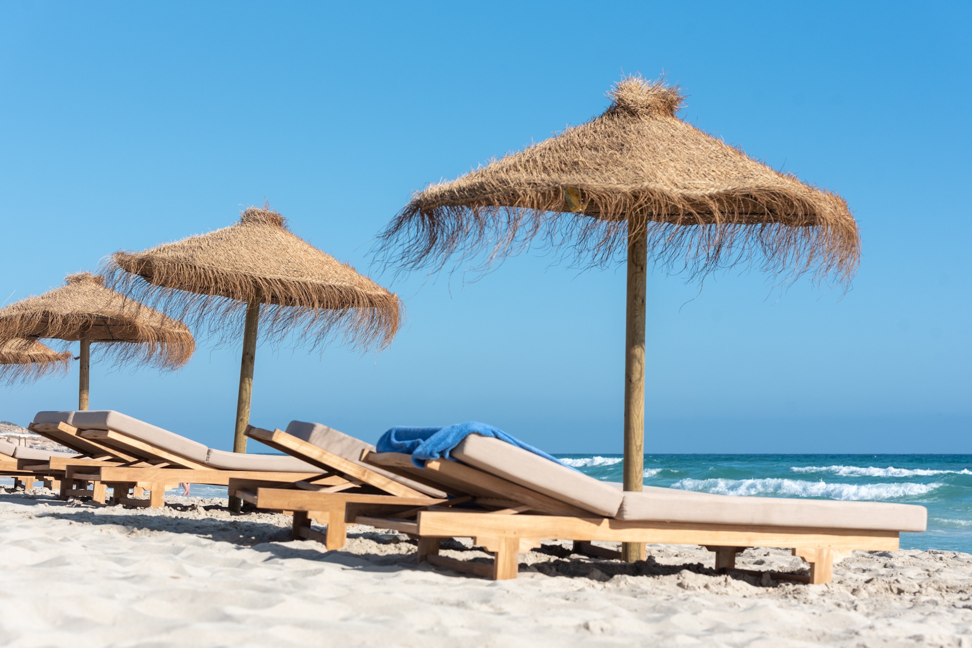 Deck chairs and straw umbrellas on the wonderful island of Formentera