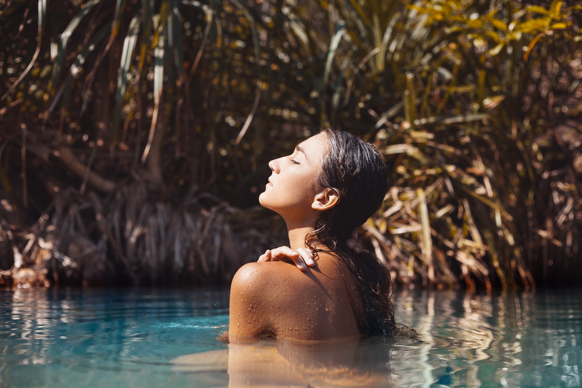attractive young woman taking bath in wild lake 1920x1280 sp Topless young woman covering her breasts by hands