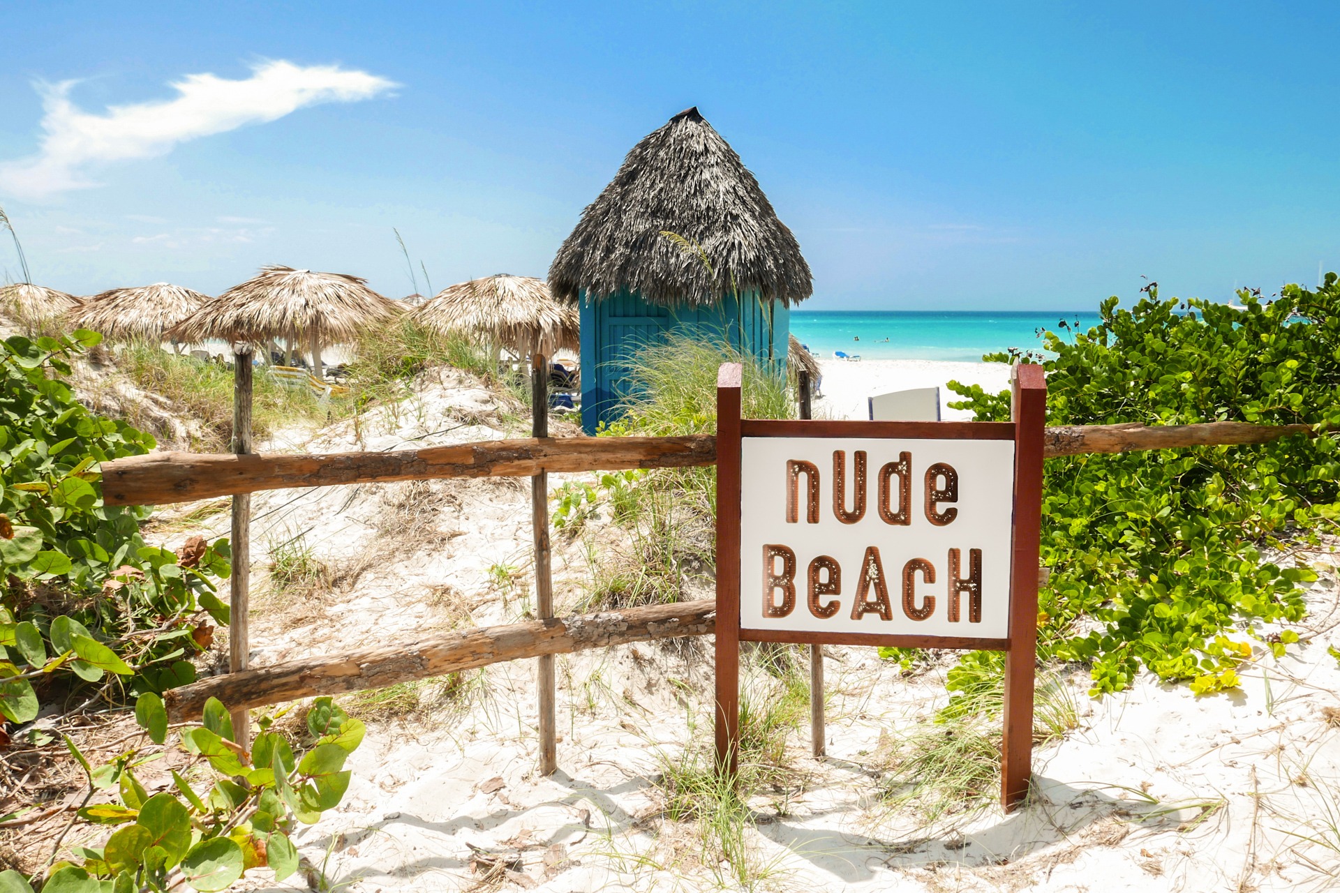 Nude Beach Sign. Sign indicating nude beach with tropical sandy FKK-Lifestyle
