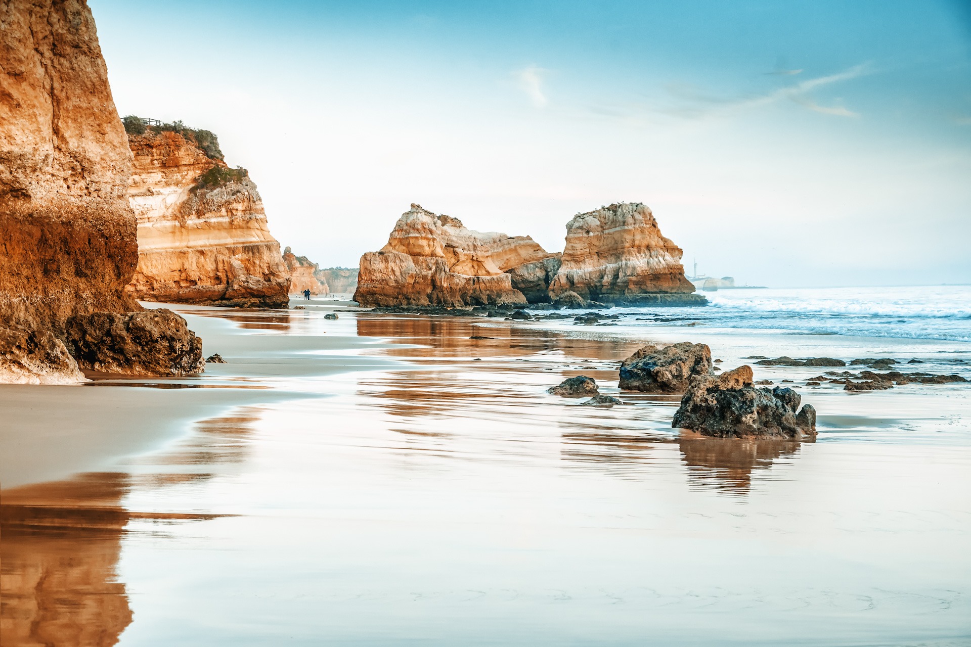 beautiful ocean landscape, the coast of Portugal, the Algarve, r Topless young woman covering her breasts by hands