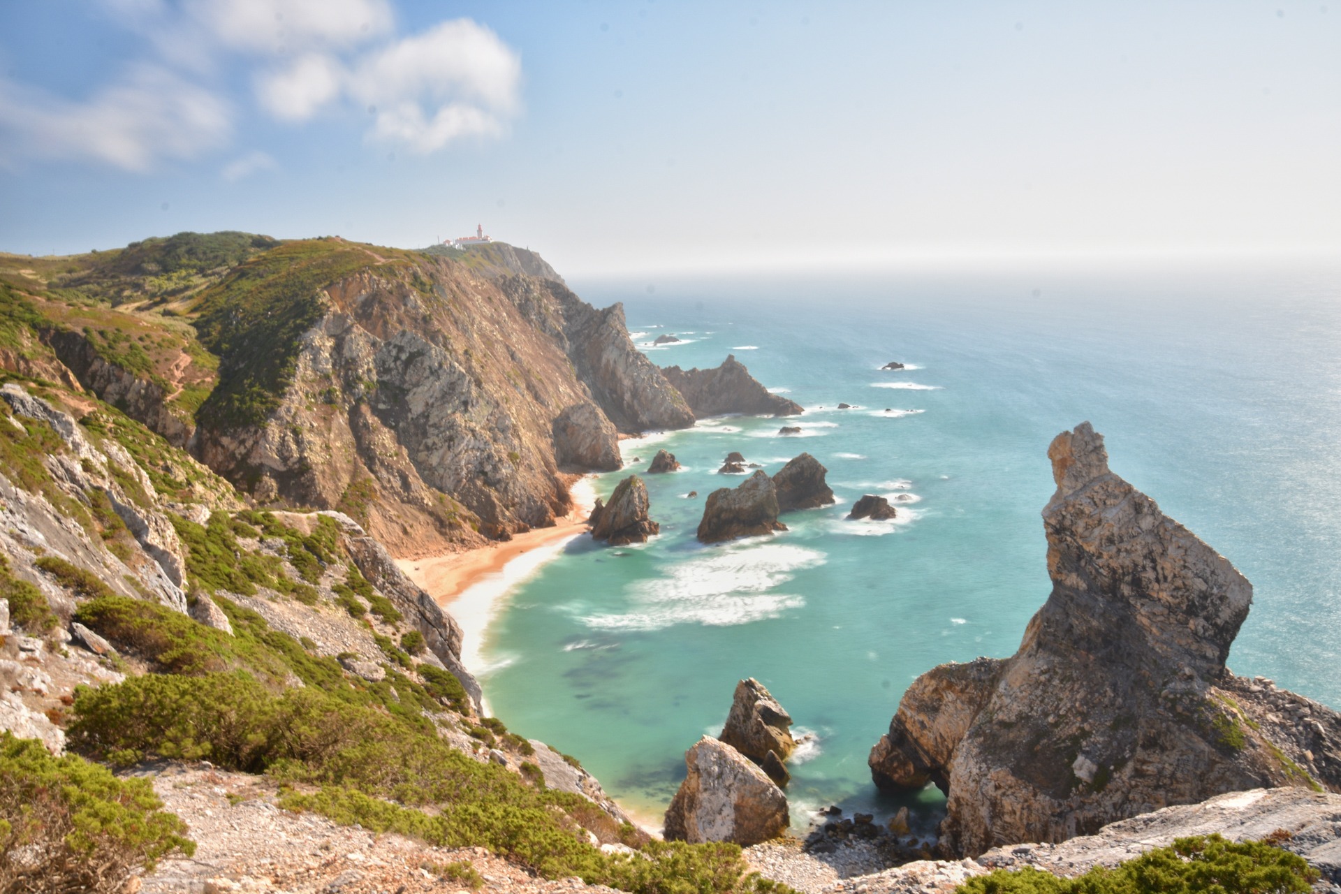 Cabo da Roca, Portugal Topless young woman covering her breasts by hands