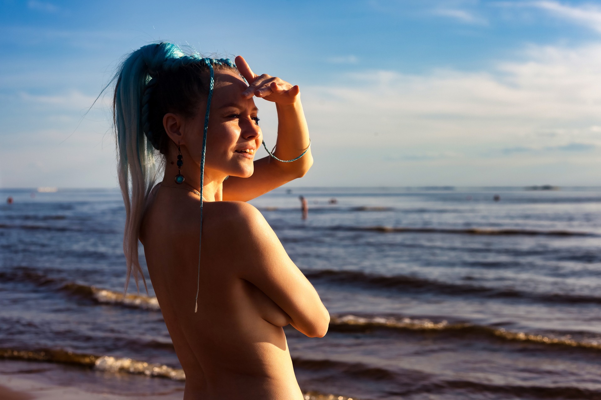 Portrait of naked woman with fashionable hairstyle on nudist sea FKK-Lifestyle