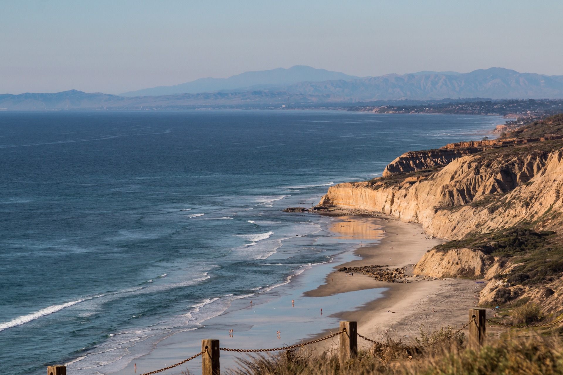 Black’s Beach Nudist Beach California Topless young woman covering her breasts by hands