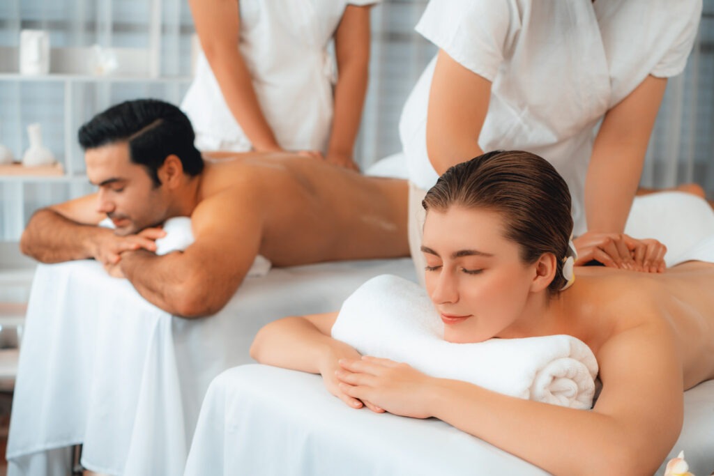 Caucasian couple customer enjoying relaxing anti-stress massage. Quiescent FKK-Lifestyle
