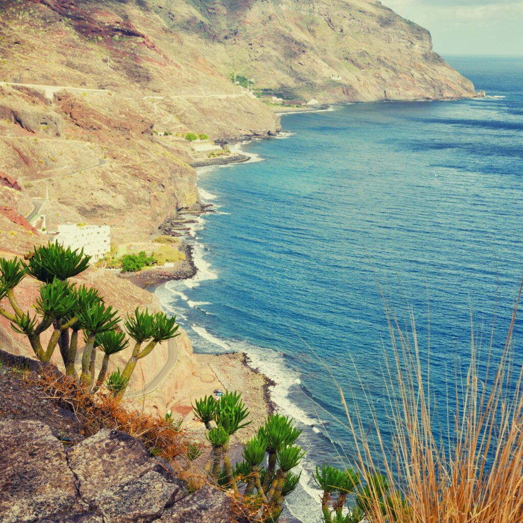 Playa de Las Gaviotas aerial view. Tenerife minimalist seascape with rocks. Filtered image, cross processed effect. Playa de Maspalomas Gran Canaria FKK Strand mit Dünen und Meerblick