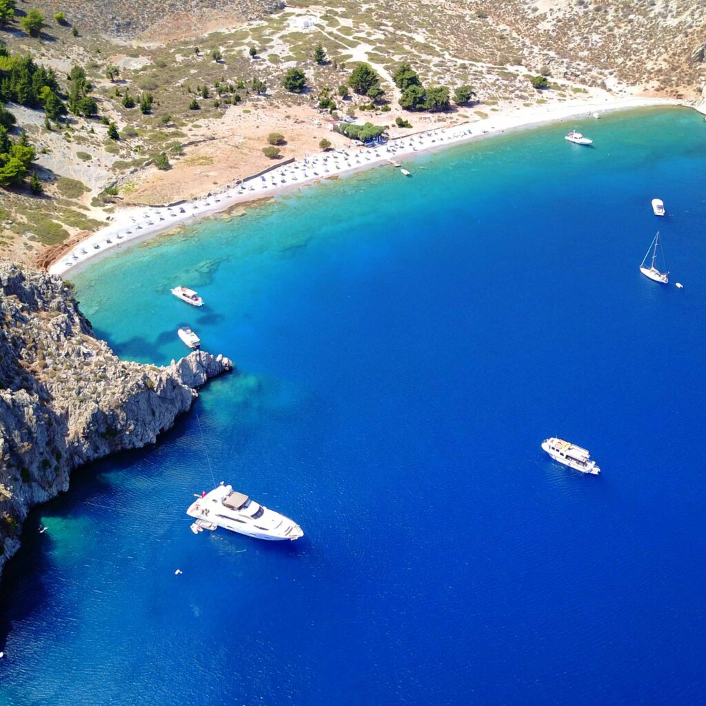 Aerial birds eye view photo taken by drone of famous tropical ro Panorama FKK-Strand Mandómata bei Faliraki, Rhodos – türkisblaues Meer, Natur und Liegen, Griechenland