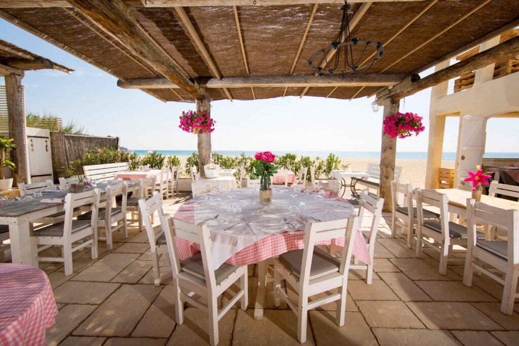Restaurant terrace on sandy Tarifa beach, Costa de la Luz, Spain